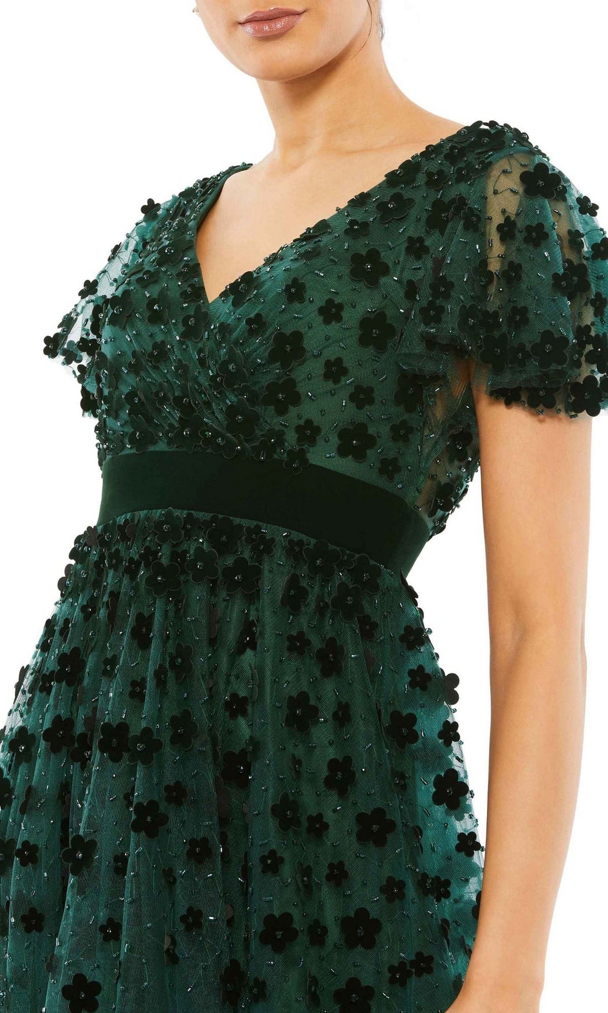 Woman wearing the Floral Midi Wedding Guest Dress: Mac Duggal 67854—a dark green, vintage-inspired dress with short sleeves, V-neckline, black floral appliqués, and a fitted waistband.